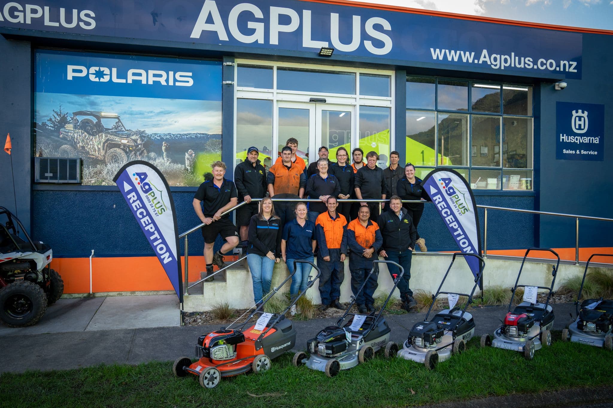 team in front of store